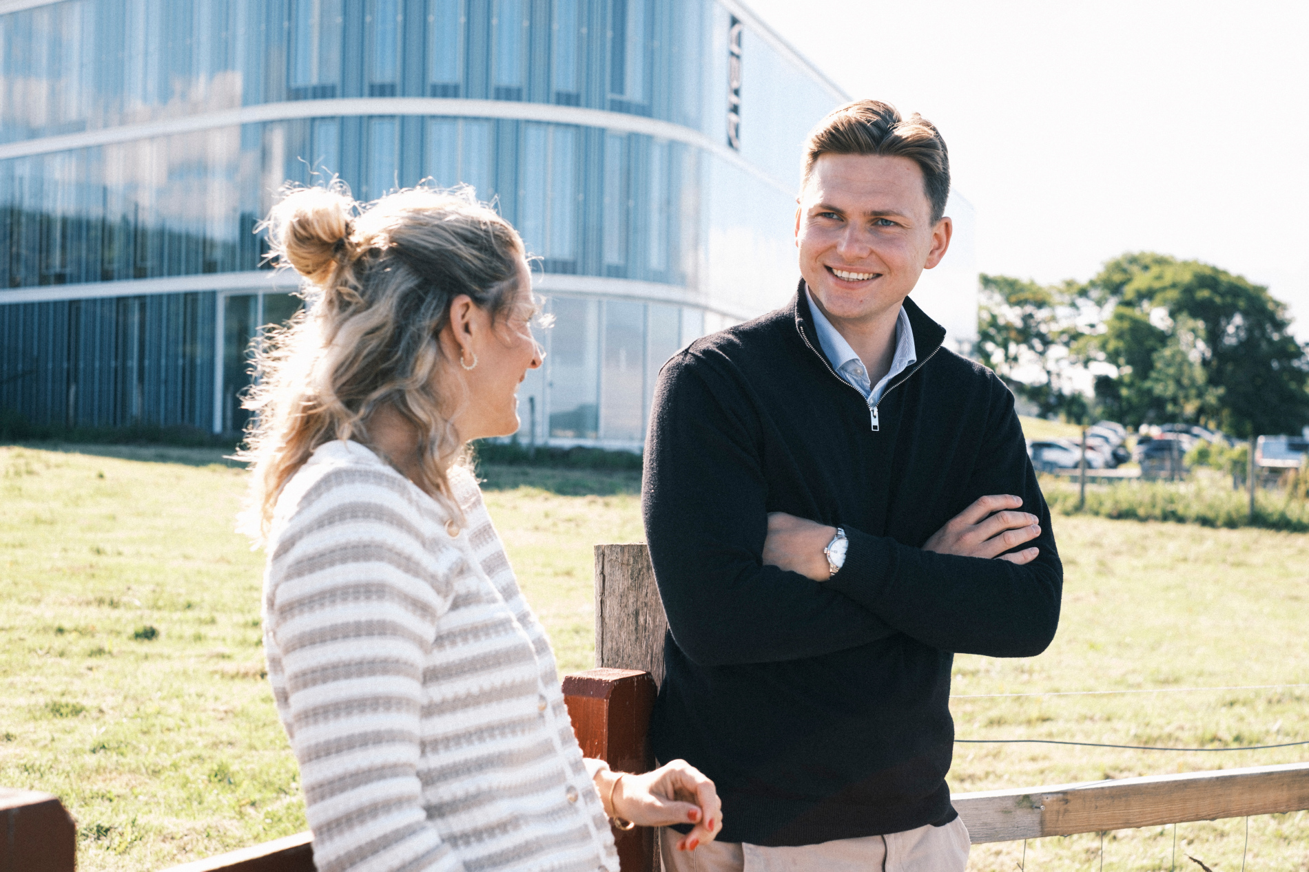 A Man And A Woman Talking Outside
