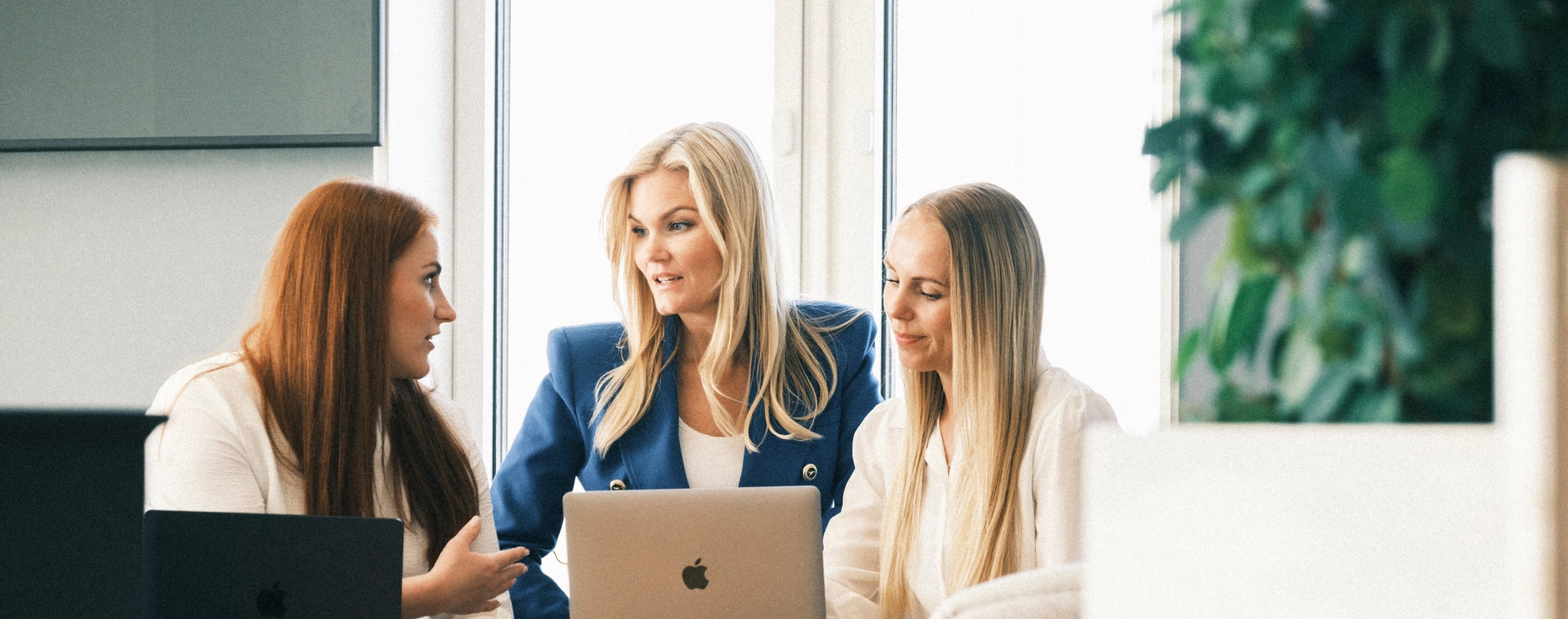 Three Woman Watching Mac And Talking