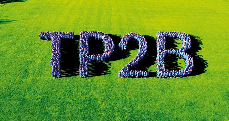 tp2b logo on grass