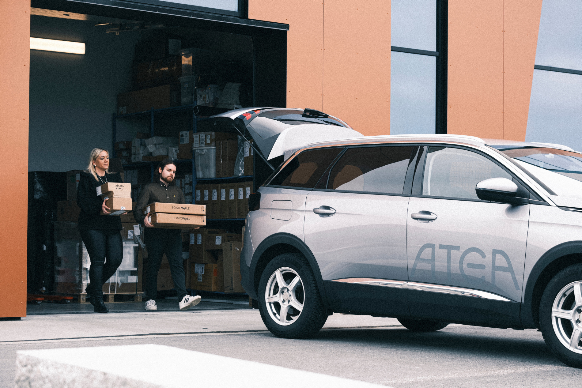 Man And Woman Loading Atea Car