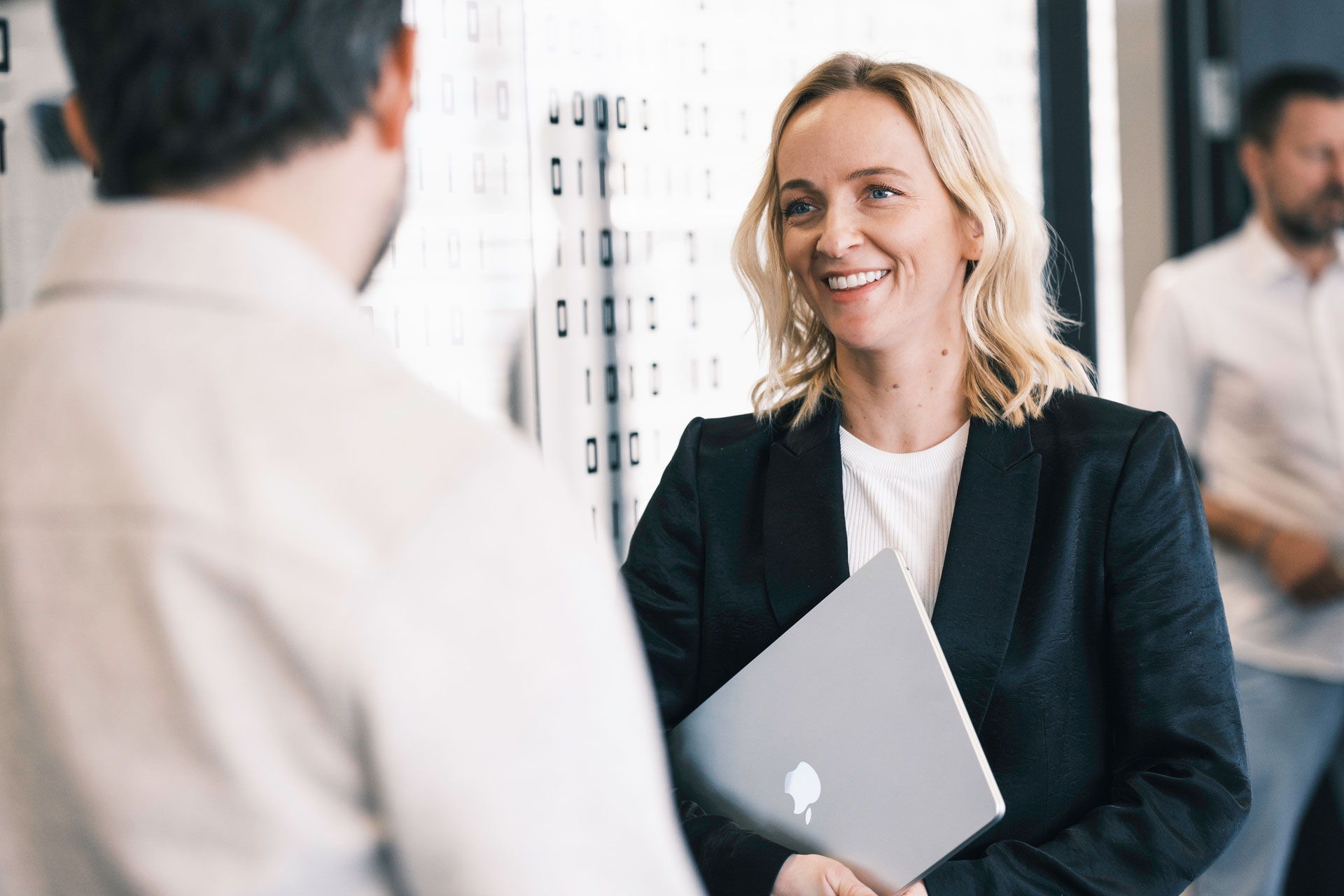 Woman Talking To Man Outside Meetingroom