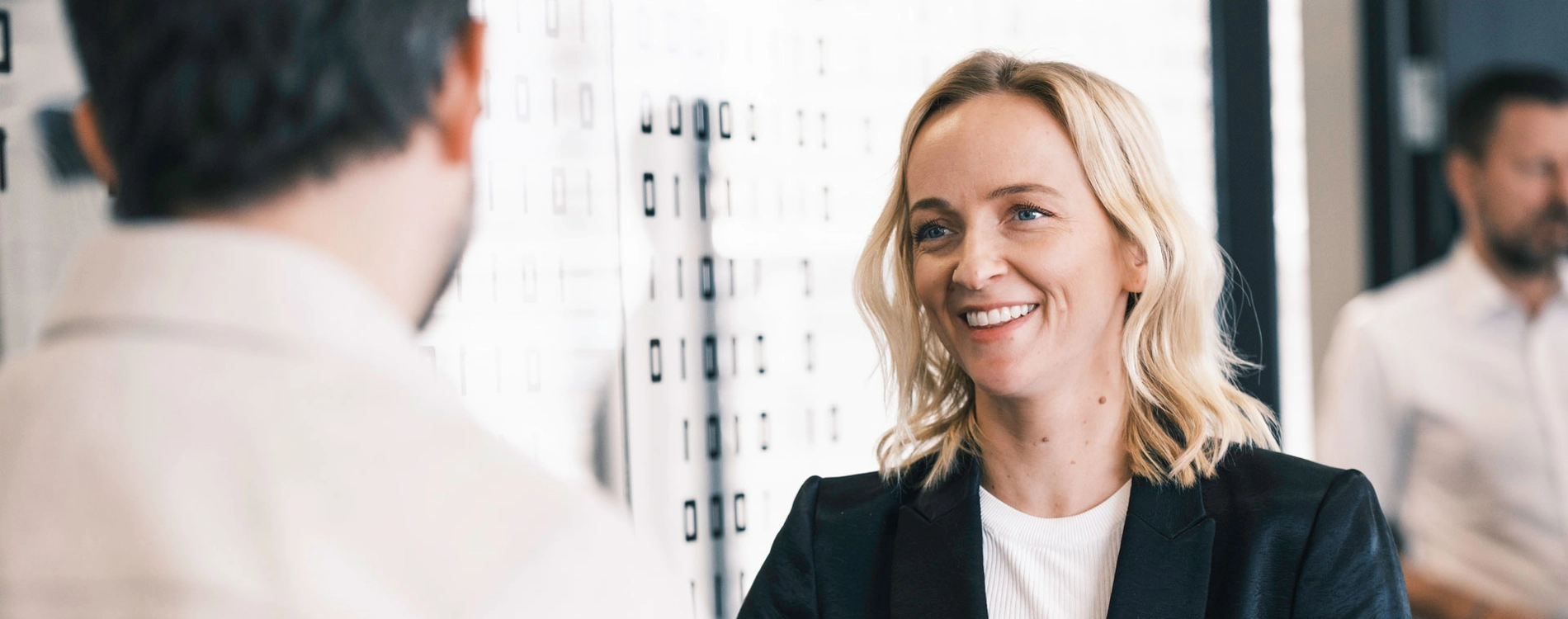 Woman Talking To Man Outside Meetingroom